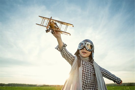 Little boy with wooden airplane outdoors Stock Photo - Royalty-Free, Artist: Deklofenak, Image code: 400-08261158