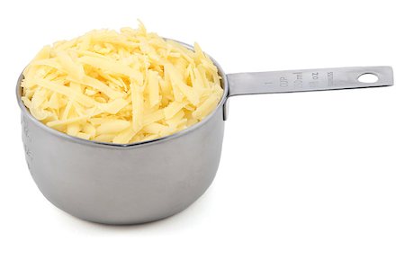 Grated cheese in an American measuring cup, isolated on a white background Foto de stock - Super Valor sin royalties y Suscripción, Código: 400-08261478