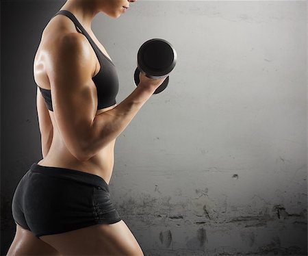 simsearch:400-08505882,k - Athletic muscular woman workout with grunge background Stock Photo - Budget Royalty-Free & Subscription, Code: 400-08261481