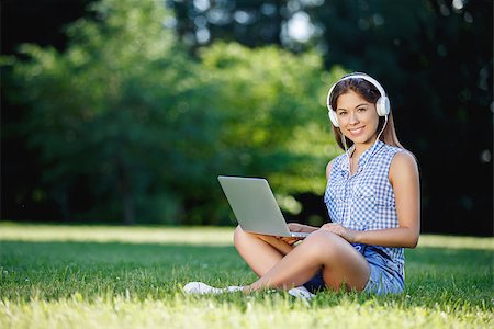 Young girl with a laptop outdoors Stock Photo - Budget Royalty-Free & Subscription, Code: 400-08262166