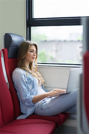 Young girl with a laptop on the train Stock Photo - Budget Royalty-Free & Subscription, Code: 400-08262191