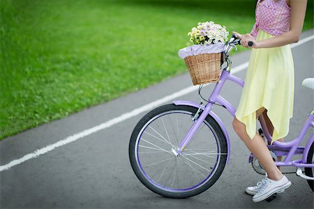 riding bike with basket - Young girl on a bicycle Stock Photo - Budget Royalty-Free & Subscription, Code: 400-08263071