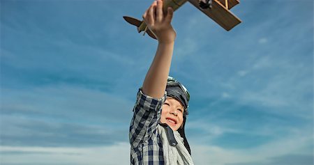 pilots with scarves - Little boy with wooden airplane Stock Photo - Budget Royalty-Free & Subscription, Code: 400-08263092