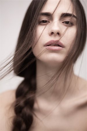 Closeup portrait of a fashion model with long hair posing at studio Stock Photo - Budget Royalty-Free & Subscription, Code: 400-08263145