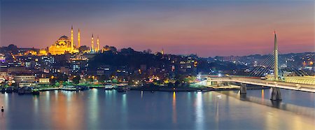 Panoramic image of Istanbul with Suleymaniye Mosque and Golden Horn Metro Bridge at sunset. Stock Photo - Budget Royalty-Free & Subscription, Code: 400-08263991