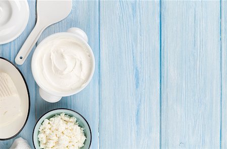 simsearch:400-08296754,k - Dairy products on wooden table. Sour cream, milk, cheese and yogurt. Top view with copy space Stock Photo - Budget Royalty-Free & Subscription, Code: 400-08284703