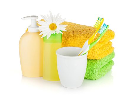 simsearch:400-04789848,k - Toothbrushes, shampoo bottles, two towels and flower. Isolated on white background Stock Photo - Budget Royalty-Free & Subscription, Code: 400-08284719