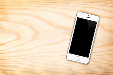 simsearch:400-09151522,k - Smart phone on wooden table background with copy space Photographie de stock - Aubaine LD & Abonnement, Code: 400-08284710