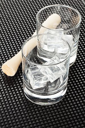 dark rum - Cocktail glasses with ice and muddler on black rubber mat Stock Photo - Budget Royalty-Free & Subscription, Code: 400-08284730