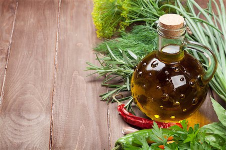 simsearch:400-07578178,k - Fresh garden herbs and olive oil on wooden table. View with copy space Stock Photo - Budget Royalty-Free & Subscription, Code: 400-08284760