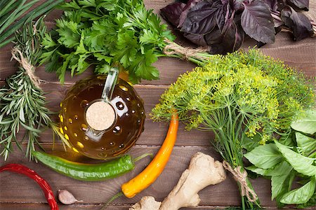 simsearch:400-07578178,k - Fresh garden herbs and olive oil on wooden table. Top view Stock Photo - Budget Royalty-Free & Subscription, Code: 400-08284761