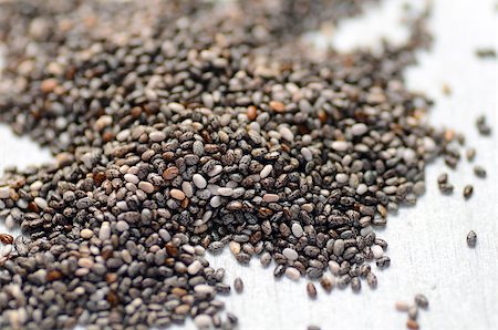 raw organic black chia seeds, close-up image Foto de stock - Super Valor sin royalties y Suscripción, Código: 400-08284782