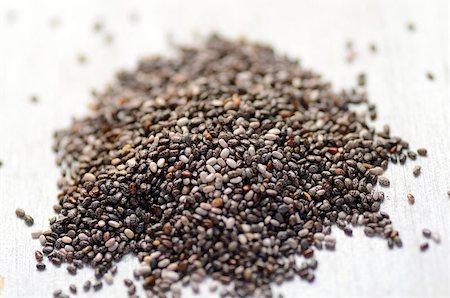 raw organic black chia seeds, close-up image Foto de stock - Super Valor sin royalties y Suscripción, Código: 400-08284783