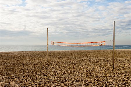 photojope (artist) - Beach volleyball net in an empty court in a cloudy day in the morning on the coast. Photographie de stock - Aubaine LD & Abonnement, Code: 400-08285196