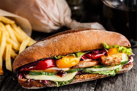 simsearch:400-04416282,k - Chicken sandwich, fries and glass of soda on a rustic table Stock Photo - Budget Royalty-Free & Subscription, Code: 400-08286429