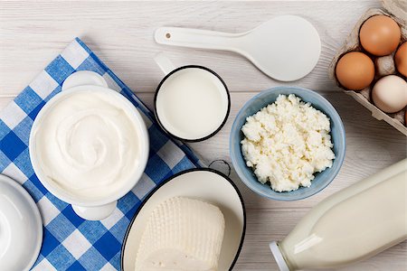 simsearch:400-08296754,k - Dairy products on wooden table. Sour cream, milk, cheese, eggs and yogurt. Top view Stock Photo - Budget Royalty-Free & Subscription, Code: 400-08286474