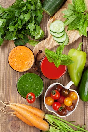 simsearch:400-07172598,k - Fresh vegetable smoothie on wooden table. Tomato, cucumber, carrot. Top view Stock Photo - Budget Royalty-Free & Subscription, Code: 400-08286596