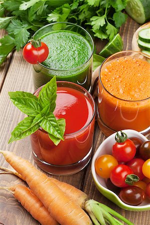simsearch:400-07172598,k - Fresh vegetable smoothie on wooden table. Tomato, cucumber, carrot Stock Photo - Budget Royalty-Free & Subscription, Code: 400-08286597