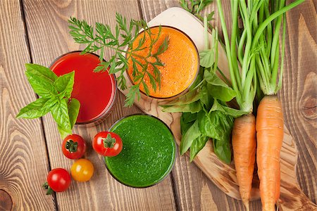 simsearch:400-07172598,k - Fresh vegetable smoothie on wooden table. Tomato, cucumber, carrot. Top view Stock Photo - Budget Royalty-Free & Subscription, Code: 400-08286598