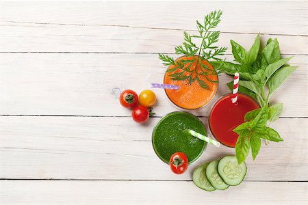 simsearch:400-07172598,k - Fresh vegetable smoothie on wooden table. Tomato, cucumber, carrot. Top view with copy space Stock Photo - Budget Royalty-Free & Subscription, Code: 400-08286599