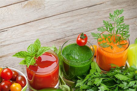 simsearch:400-07172598,k - Fresh vegetable smoothie on wooden table. Tomato, cucumber, carrot. View with copy space Stock Photo - Budget Royalty-Free & Subscription, Code: 400-08286603