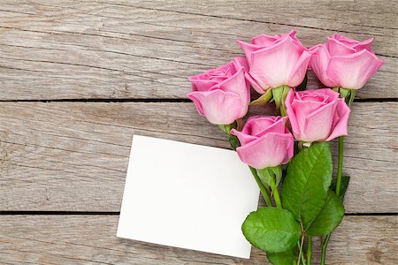 simsearch:400-08110734,k - Pink roses bouquet and blank greeting card over wooden table. Top view with copy space Stock Photo - Budget Royalty-Free & Subscription, Code: 400-08286628