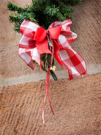 Image of a red white bow of ribbon as decoration on a Christmas market Stock Photo - Budget Royalty-Free & Subscription, Code: 400-08286688
