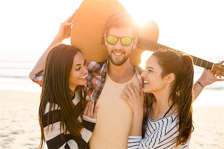 Friends  at the beach having fun together Stock Photo - Budget Royalty-Free & Subscription, Code: 400-08287060