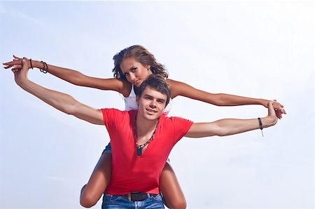 simsearch:400-06360128,k - the guy holding the girlfriend on his back Stock Photo - Budget Royalty-Free & Subscription, Code: 400-08287106