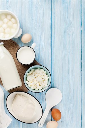 simsearch:400-08296754,k - Dairy products on wooden table. Sour cream, milk, cheese, eggs and yogurt. Top view with copy space Stock Photo - Budget Royalty-Free & Subscription, Code: 400-08287260