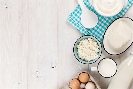 simsearch:400-08296754,k - Dairy products on wooden table. Sour cream, milk, cheese, eggs and yogurt. Top view with copy space Stock Photo - Budget Royalty-Free & Subscription, Code: 400-08287261