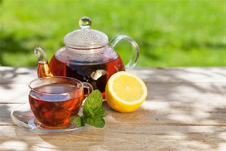 simsearch:400-06554630,k - Breakfast tea on table in sunny garden Stock Photo - Budget Royalty-Free & Subscription, Code: 400-08287273