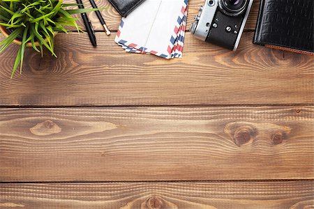 simsearch:400-08289506,k - Camera and supplies on office wooden desk table. Top view with copy space Photographie de stock - Aubaine LD & Abonnement, Code: 400-08287338