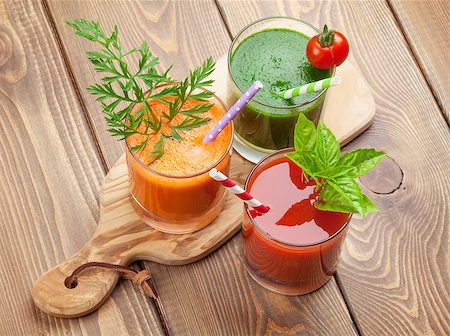 simsearch:400-07172598,k - Fresh vegetable smoothie on wooden table. Tomato, cucumber, carrot. Stock Photo - Budget Royalty-Free & Subscription, Code: 400-08287385