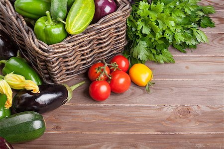 Fresh farmers garden vegetables and herbs on wooden table. View with copy space Stock Photo - Budget Royalty-Free & Subscription, Code: 400-08287405