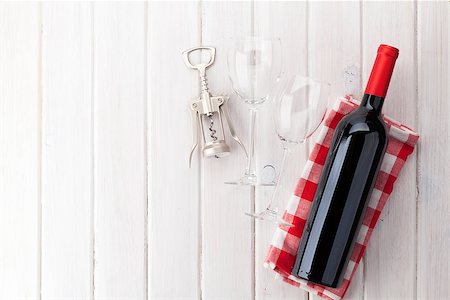 simsearch:400-07937813,k - Red wine bottle, glasses and corkscrew on white wooden table background with copy space Photographie de stock - Aubaine LD & Abonnement, Code: 400-08287453