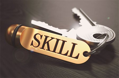 simsearch:400-08289045,k - Skill - Bunch of Keys with Text on Golden Keychain. Black Wooden Background. Closeup View with Selective Focus. 3D Illustration. Toned Image. Stock Photo - Budget Royalty-Free & Subscription, Code: 400-08287678