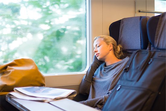 Blonde casual caucasian lady napping while traveling by train. Stock Photo - Royalty-Free, Artist: kasto, Image code: 400-08288334