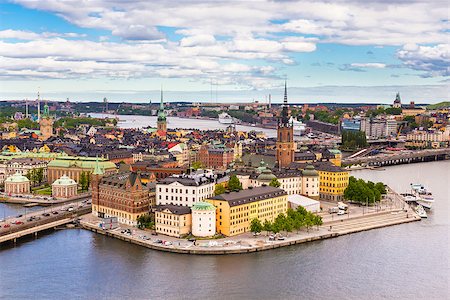 Panoramic view of swedish capital Stockholm seen from the city hall tower. Aerial view of Gamla stan, old medieval downtown. Horizontal composition. Stock Photo - Budget Royalty-Free & Subscription, Code: 400-08288335