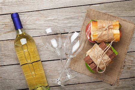 simsearch:400-07937807,k - Two sandwiches and white wine on wooden table. Top view Photographie de stock - Aubaine LD & Abonnement, Code: 400-08288452