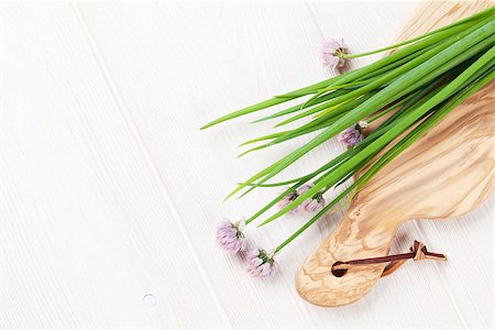 Fresh garden spring onion on white table. Top view with copy space Stock Photo - Budget Royalty-Free & Subscription, Code: 400-08288511