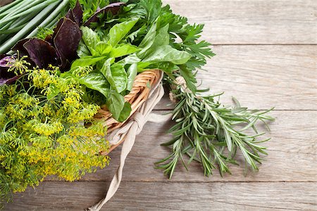 simsearch:400-07578178,k - Fresh garden herbs in basket on wooden table. Top view Stock Photo - Budget Royalty-Free & Subscription, Code: 400-08288530