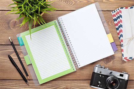 simsearch:400-08289506,k - Office desk table with calendar notepad, camera, supplies and flower. Top view Photographie de stock - Aubaine LD & Abonnement, Code: 400-08288546