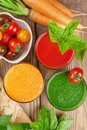 simsearch:400-07172598,k - Fresh vegetable smoothie on wooden table. Tomato, cucumber, carrot. Top view Stock Photo - Budget Royalty-Free & Subscription, Code: 400-08288589