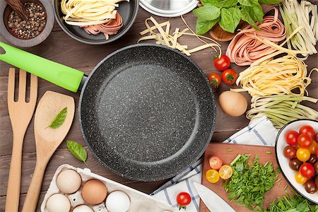 food menu board - Pasta cooking ingredients and utensils on wooden table. Top view with copy space Stock Photo - Budget Royalty-Free & Subscription, Code: 400-08288580