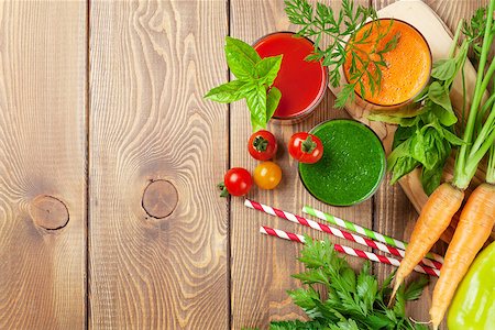 simsearch:400-07172598,k - Fresh vegetable smoothie on wooden table. Tomato, cucumber, carrot. Top view with copy space Stock Photo - Budget Royalty-Free & Subscription, Code: 400-08288591