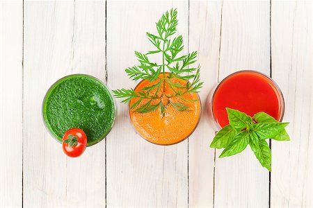simsearch:400-07172598,k - Fresh vegetable smoothie on wooden table. Tomato, cucumber, carrot. Top view Stock Photo - Budget Royalty-Free & Subscription, Code: 400-08288593