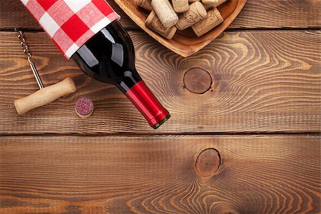 simsearch:400-07933837,k - Red wine bottle, corks and corkscrew over wooden table background. Top view with copy space Stockbilder - Microstock & Abonnement, Bildnummer: 400-08288671