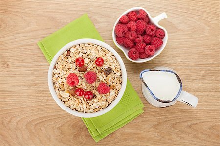 porridge and berries - Healty breakfast with muesli, berries and milk on wooden table Stock Photo - Budget Royalty-Free & Subscription, Code: 400-08289447