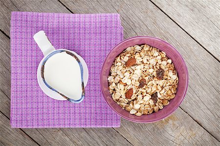 simsearch:400-08113690,k - Healthy breakfast with muesli and milk. View from above on wooden table Stock Photo - Budget Royalty-Free & Subscription, Code: 400-08289449